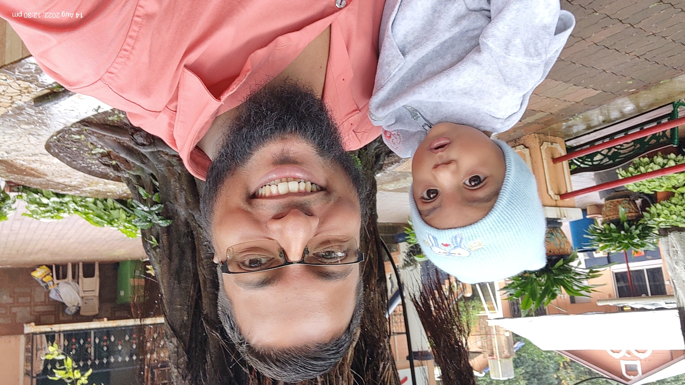 Mohammed Sharif with baby in form house
